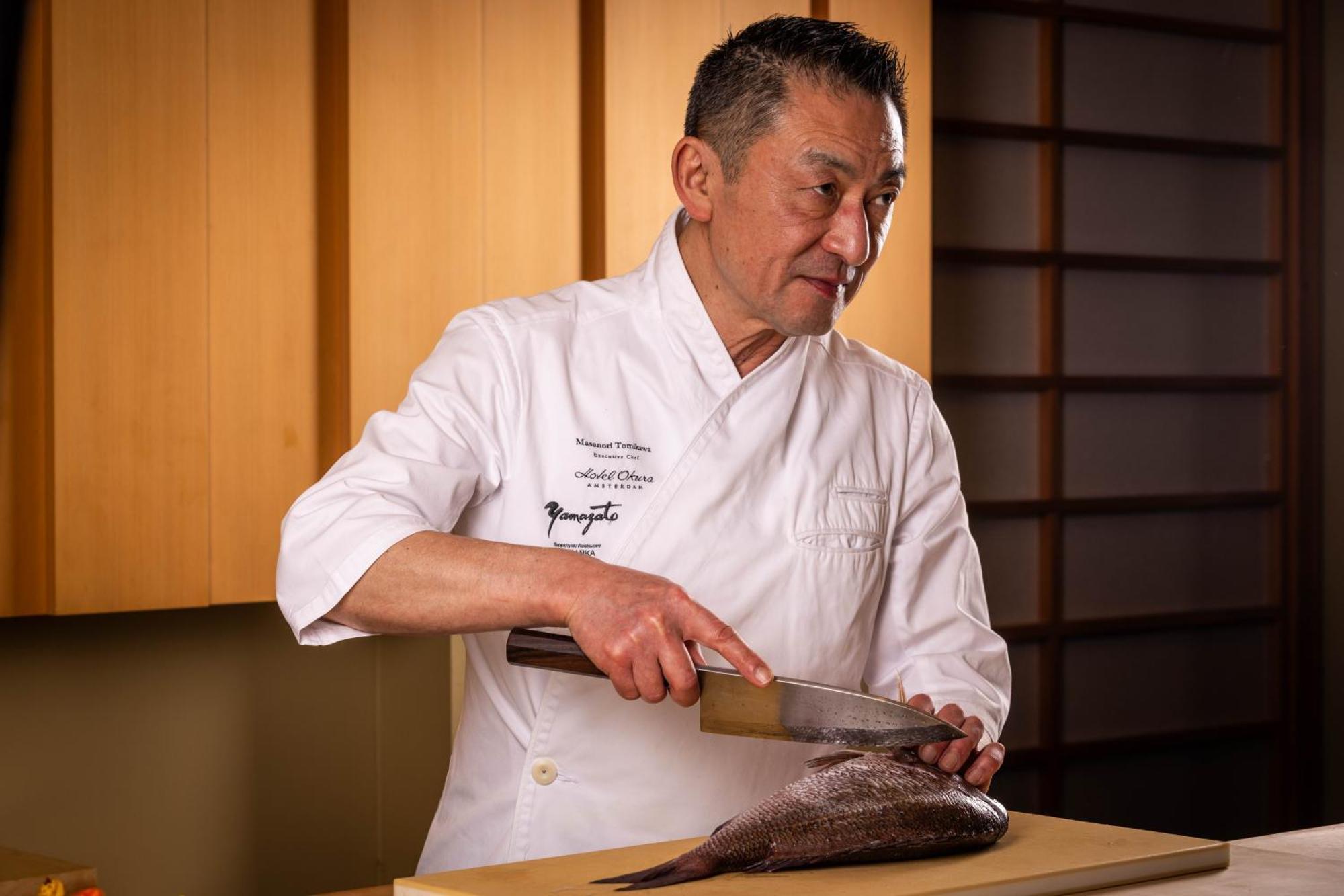 Hotel Okura Amsterdam - The Leading Hotels Of The World Екстер'єр фото Chef preparing a fish